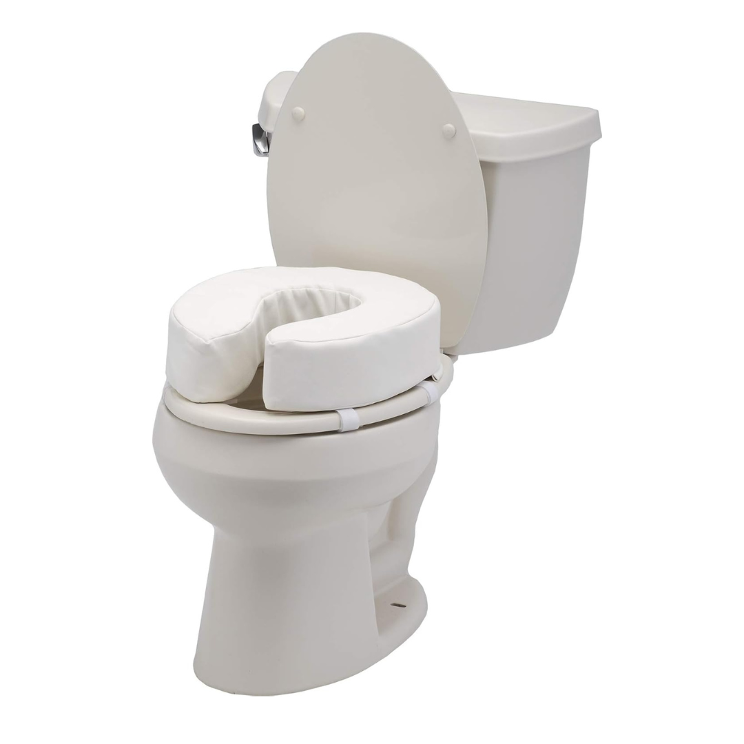 The Nova Medical Toilet Seat Cushion and Riser is a white, U-shaped foam cushion that adds comfort and support. It features velcro straps for secure, easy installation and fits over the toilet with the lid open for extra stability.